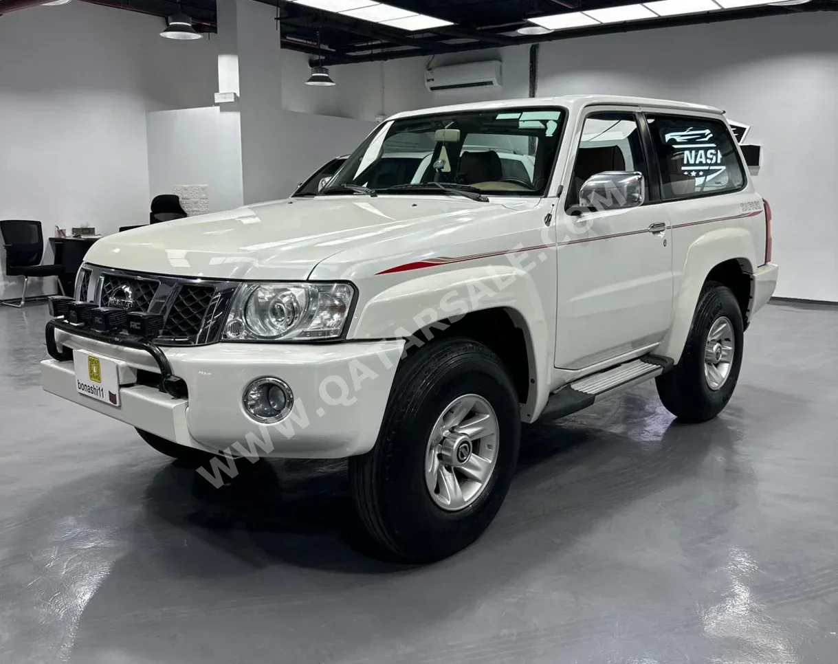 Nissan  Patrol  Safari  2013  Manual  87,000 Km  6 Cylinder  Four Wheel Drive (4WD)  SUV  White  With Warranty