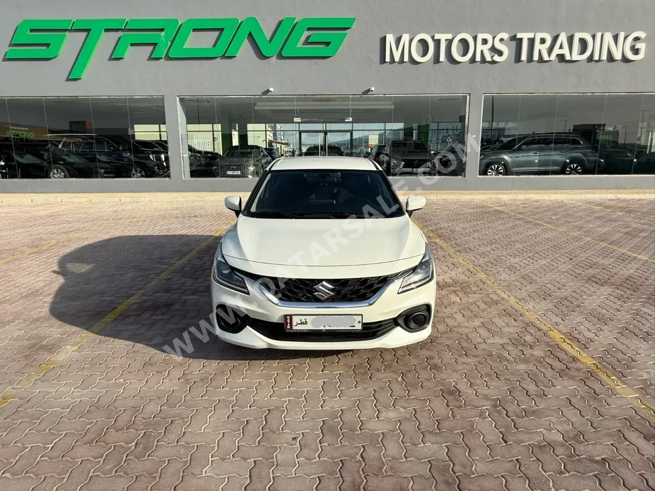 Suzuki  Baleno  2024  Automatic  65,000 Km  4 Cylinder  Front Wheel Drive (FWD)  Hatchback  White  With Warranty