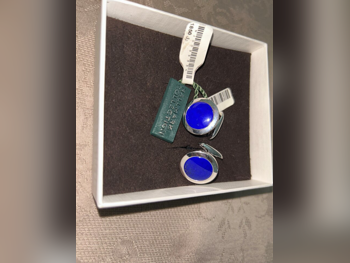 أزرار أكمام ازرق وفضي