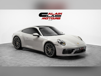 Porsche  911  Carrera  2023  Automatic  10,433 Km  6 Cylinder  Rear Wheel Drive (RWD)  Coupe / Sport  Gray