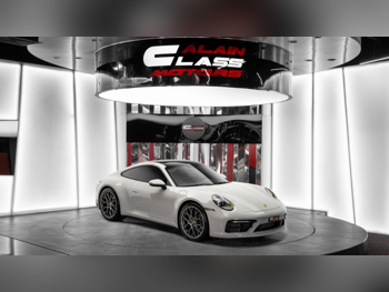 Porsche  911  Carrera  2023  Automatic  10,433 Km  6 Cylinder  Rear Wheel Drive (RWD)  Coupe / Sport  Gray