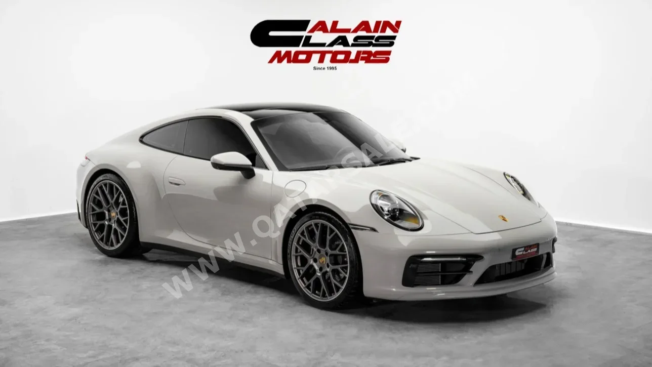 Porsche  911  Carrera  2023  Automatic  10,433 Km  6 Cylinder  Rear Wheel Drive (RWD)  Coupe / Sport  Gray
