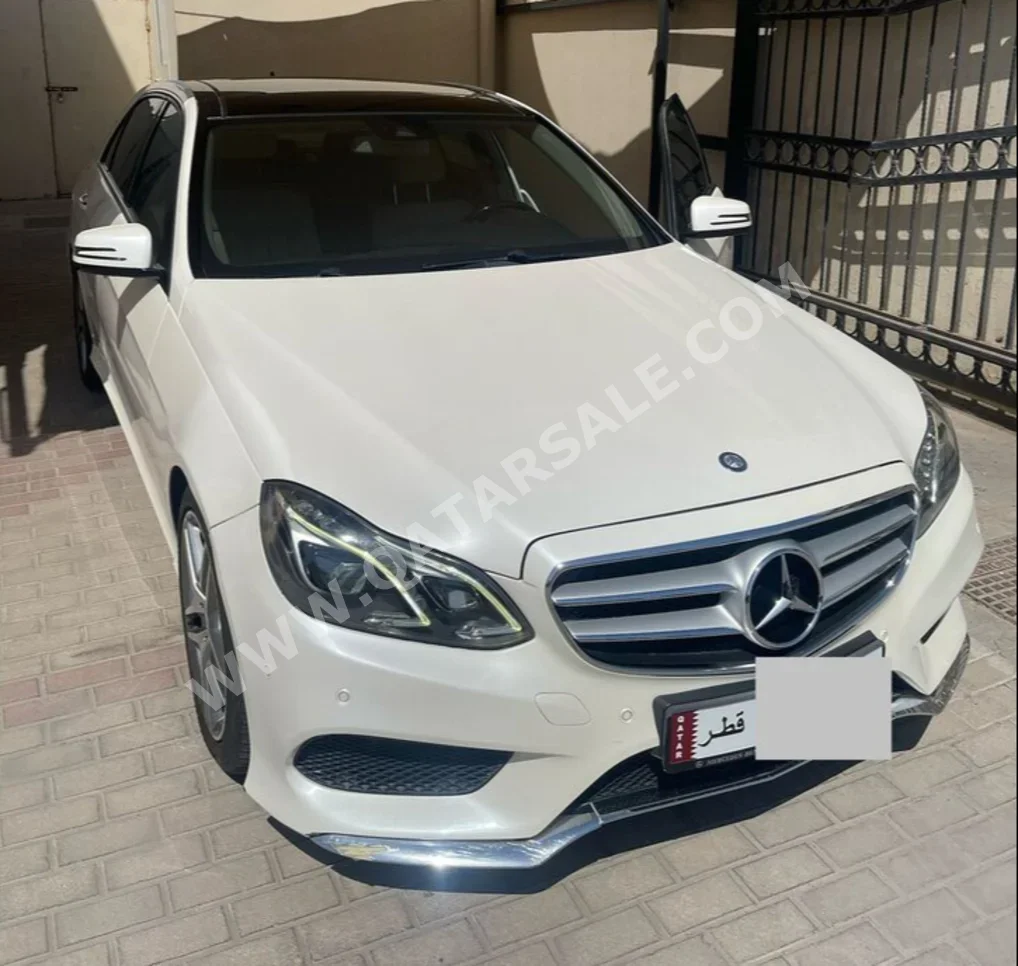 Mercedes-Benz  E-Class  300  2014  Automatic  60,000 Km  6 Cylinder  Rear Wheel Drive (RWD)  Sedan  White