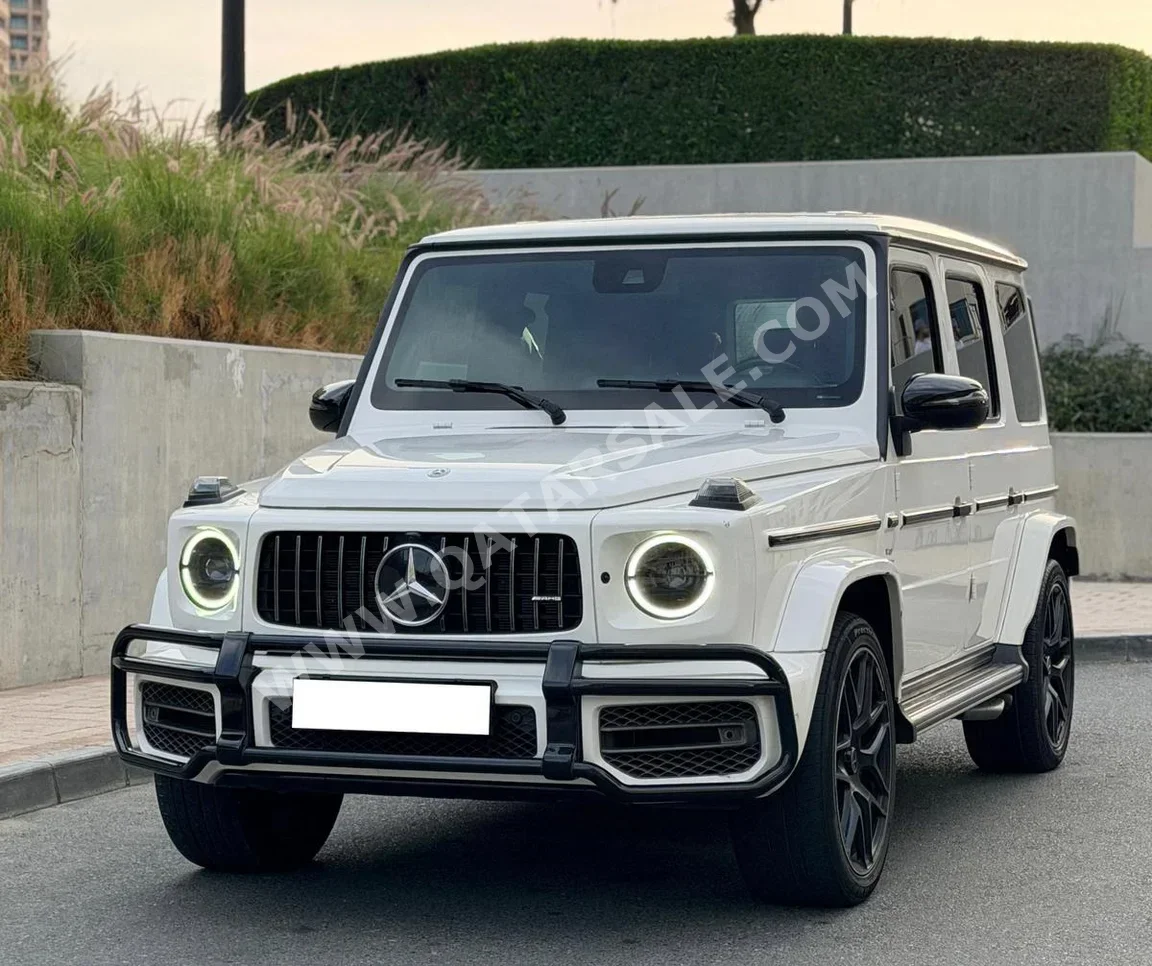 مرسيدس - بنز جي - كلاس 63 اي ام جي 2022 اوتوماتيك 89,000 كم 8 سلندر دفع رباعي اس يو في أبيض تحت الضمان
