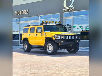 Hummer  H2  2005  Automatic  335,000 Km  8 Cylinder  Four Wheel Drive (4WD)  SUV  Yellow