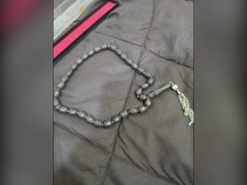 مسبحة احجار كريمة أسود & بني البيضاوي / الدائرة 0 ملي 33 0 غرام