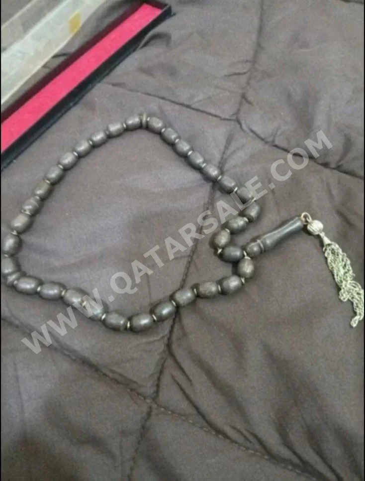 مسبحة احجار كريمة  أسود & بني  البيضاوي / الدائرة  0 ملي  33  0 غرام