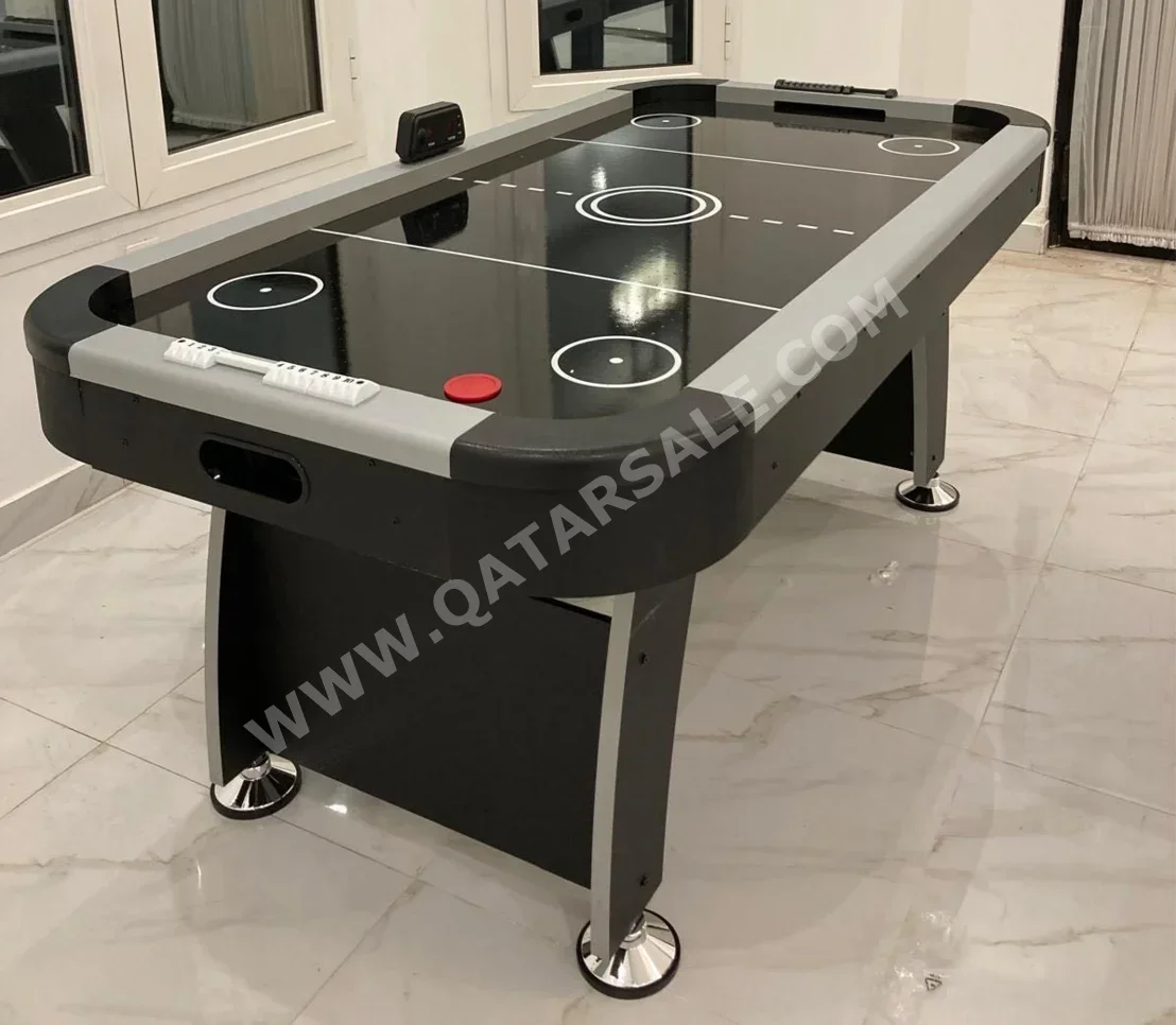أسود طاولة الهوكي