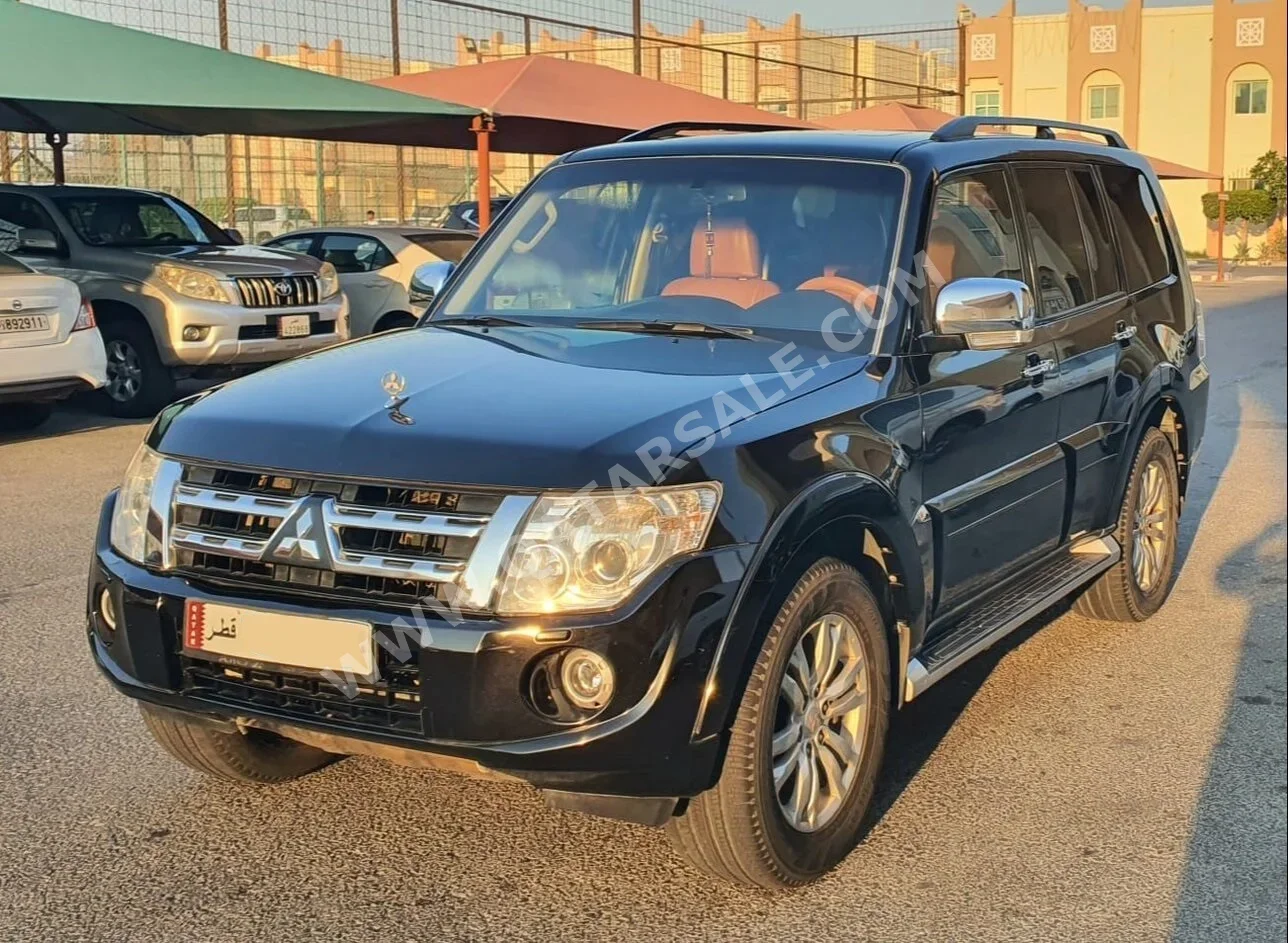 ميتسوبيشي باجيرو 3.8 2014 اوتوماتيك 252,000 كم 6 سلندر دفع رباعي اس يو في أسود