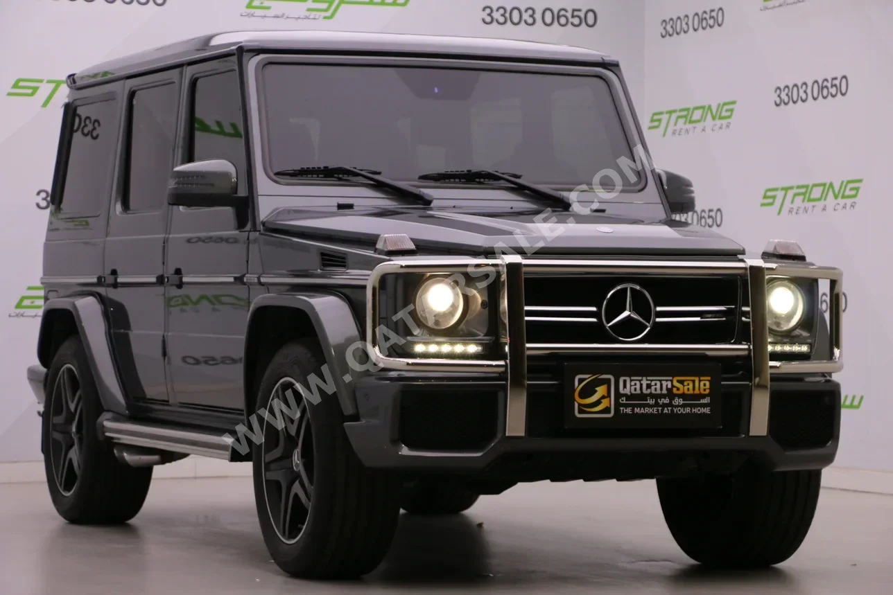 مرسيدس - بنز جي - كلاس 63 اي ام جي 2015 اوتوماتيك 147,000 كم 8 سلندر دفع رباعي اس يو في رمادي