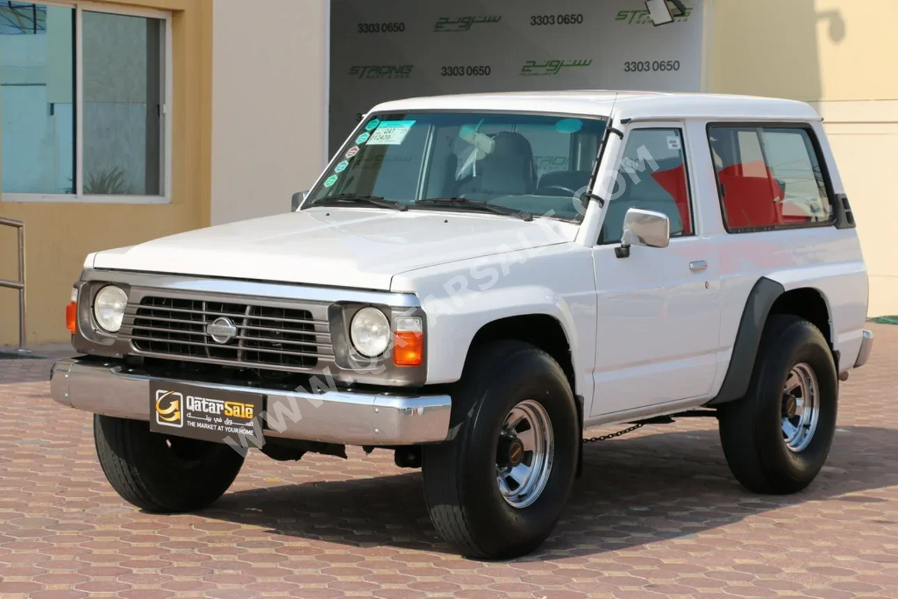 نيسان باترول جي ال 1995 عادي 135,000 كم 6 سلندر دفع رباعي اس يو في أبيض