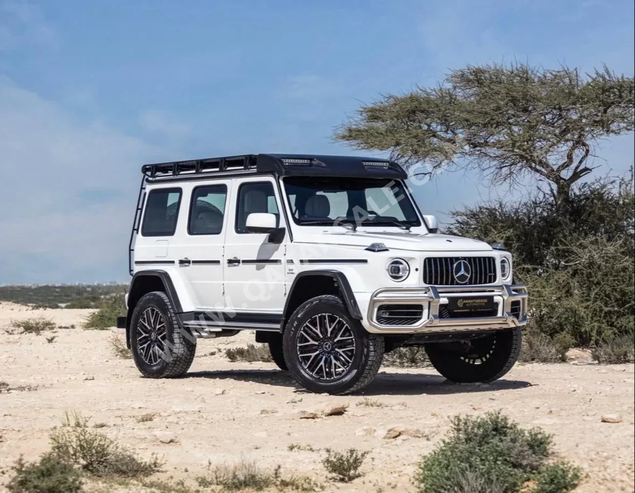 مرسيدس - بنز جي - كلاس 63 اي ام جي 2023 اوتوماتيك 15,000 كم 8 سلندر دفع رباعي اس يو في أبيض تحت الضمان