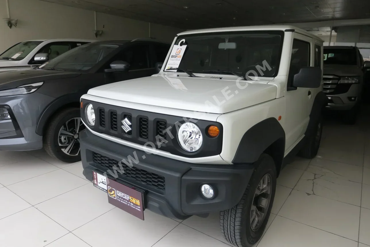 Suzuki  Jimny  2023  Manual  12,000 Km  4 Cylinder  Four Wheel Drive (4WD)  SUV  White  With Warranty