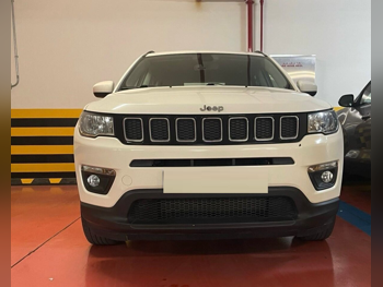 Jeep  Compass  longitude  2021  Automatic  67,000 Km  4 Cylinder  Four Wheel Drive (4WD)  SUV  White and Black