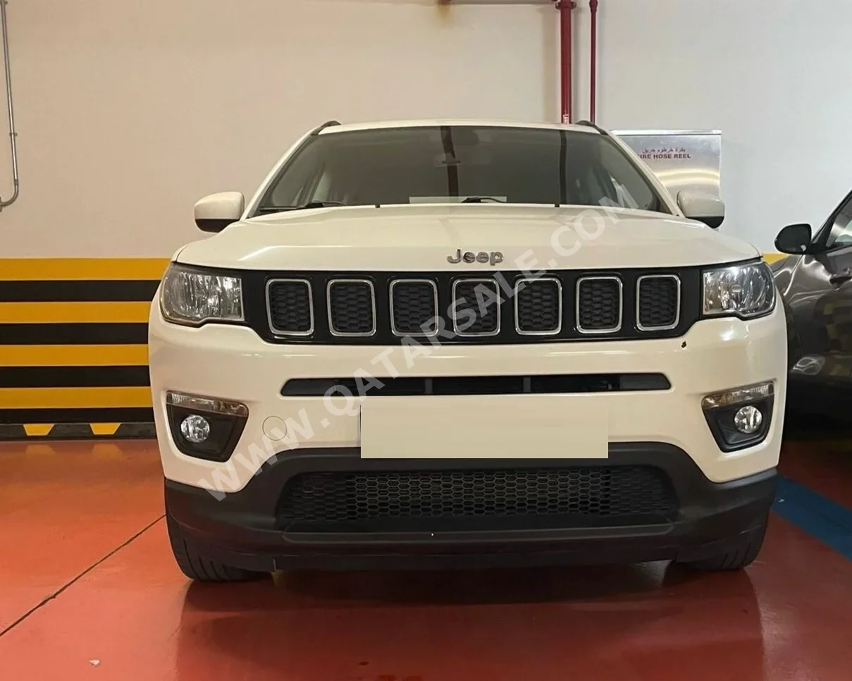 Jeep  Compass  longitude  2021  Automatic  67,000 Km  4 Cylinder  Four Wheel Drive (4WD)  SUV  White and Black
