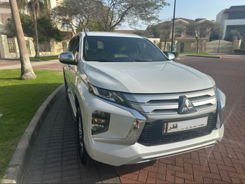 Mitsubishi  Pajero  Montero Sport  2023  Automatic  33,000 Km  6 Cylinder  Four Wheel Drive (4WD)  SUV  White  With Warranty