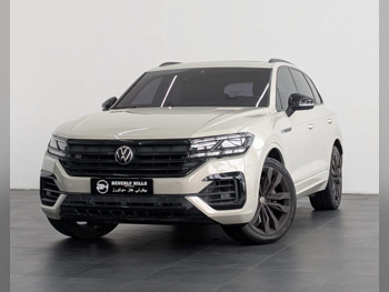 فوكس واغن  طوارق  R line  2022  اوتوماتيك  62,197 كم  6 سلندر  دفع كلي مستمر  اس يو في  بيج  تحت الضمان