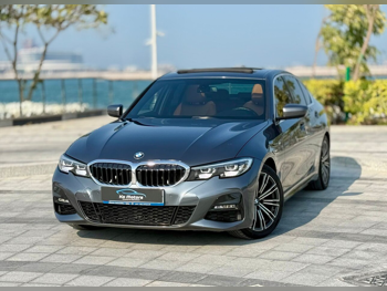 BMW  3-Series  320i  2021  Automatic  69,000 Km  4 Cylinder  Rear Wheel Drive (RWD)  Sedan  Gray