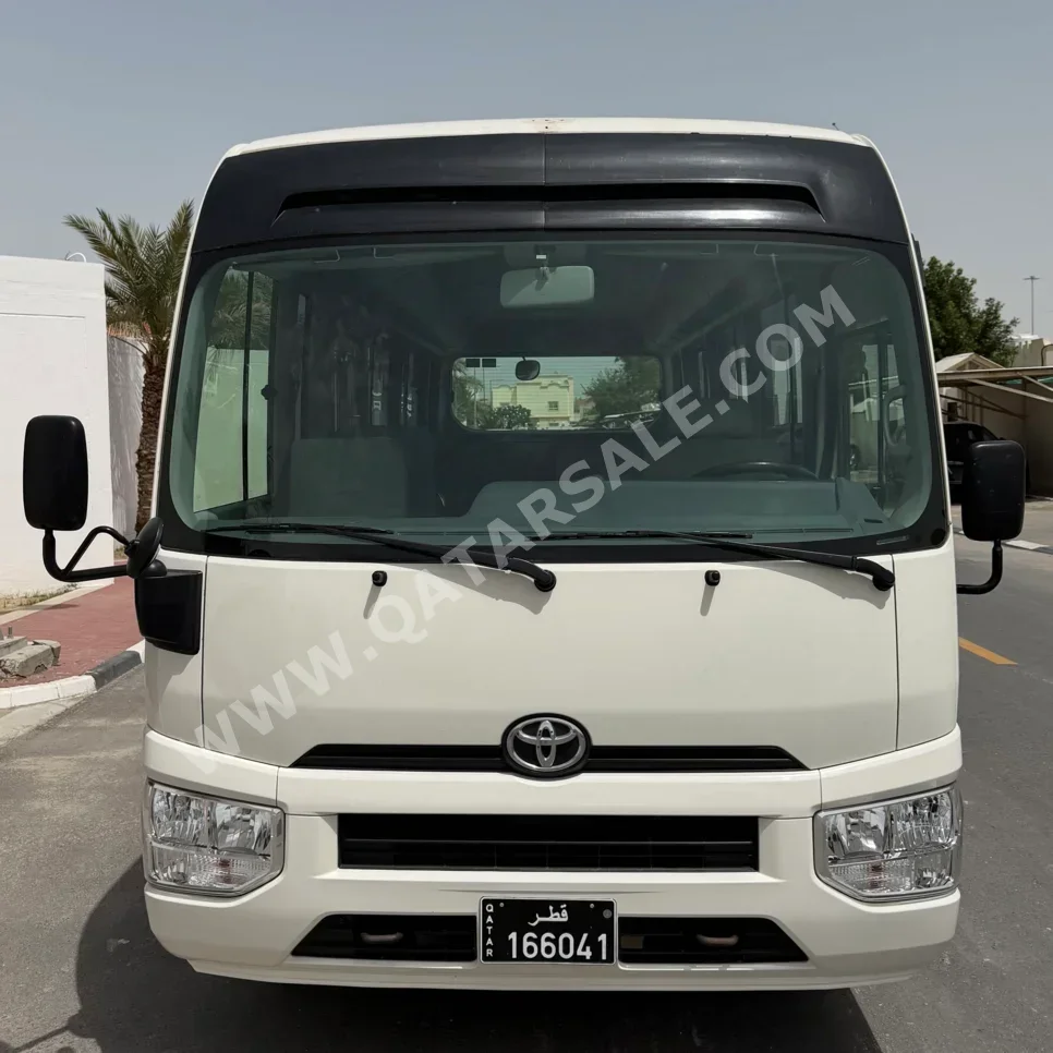 Toyota  Coaster  2020  Manual  265,000 Km  4 Cylinder  Rear Wheel Drive (RWD)  Van / Bus  White