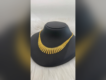 الذهب طقم  البحرين  نسائي  حسب القطعة ( ديزاينرز)  بدون حجر  ضمان الصيانة  توصيل مجاني  ذهب أصفر  عيار 21