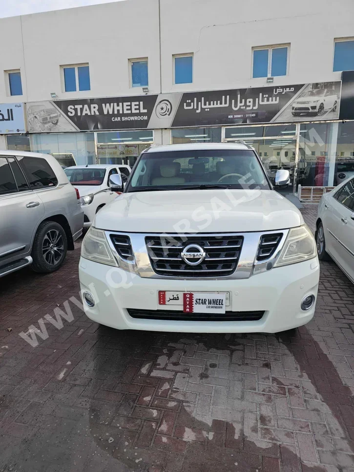 Nissan  Patrol  Platinum  2014  Automatic  391,000 Km  8 Cylinder  Four Wheel Drive (4WD)  SUV  White