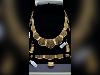 الذهب طقم البحرين نسائي حسب الوزن 39.88 غرام بدون حجر ضمان الصيانة توصيل مجاني ذهب أصفر عيار 21