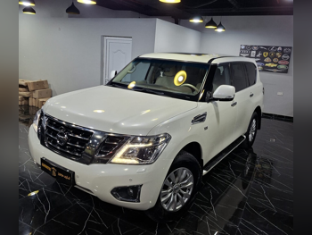 Nissan  Patrol  SE  2015  Automatic  200,000 Km  8 Cylinder  Four Wheel Drive (4WD)  SUV  White