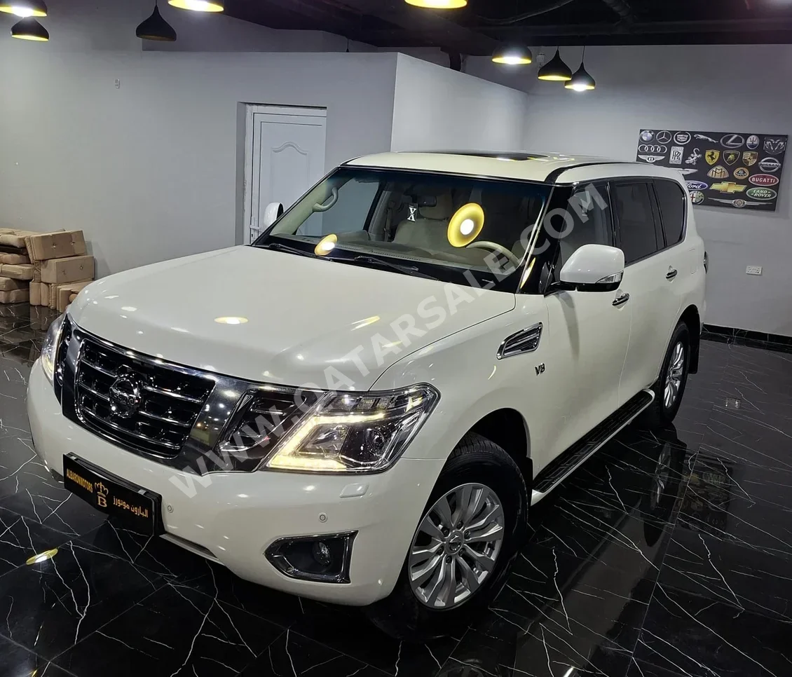 نيسان  باترول  اس اي  2015  اوتوماتيك  200,000 كم  8 سلندر  دفع رباعي  اس يو في  أبيض