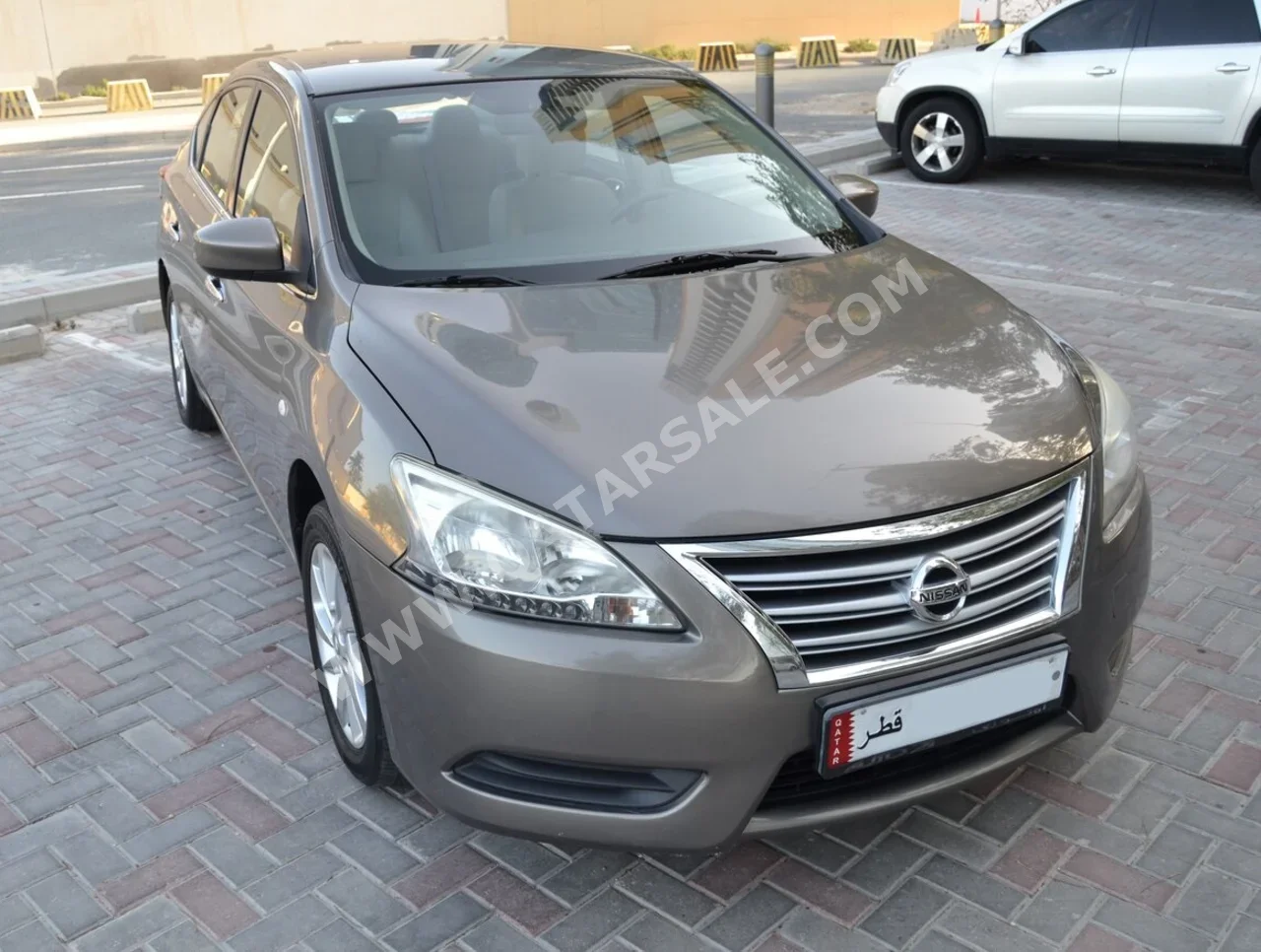 Nissan  Sentra  2014  Manual  99,999 Km  4 Cylinder  Front Wheel Drive (FWD)  Sedan  Bronze