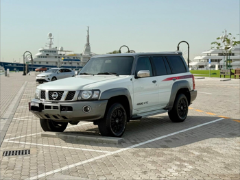 Nissan  Patrol  Super Safari  2019  Automatic  115,000 Km  6 Cylinder  Four Wheel Drive (4WD)  SUV  White and Gray