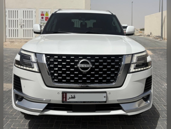 Nissan  Patrol  Titanium  2023  Automatic  136,000 Km  6 Cylinder  Four Wheel Drive (4WD)  SUV  White  With Warranty