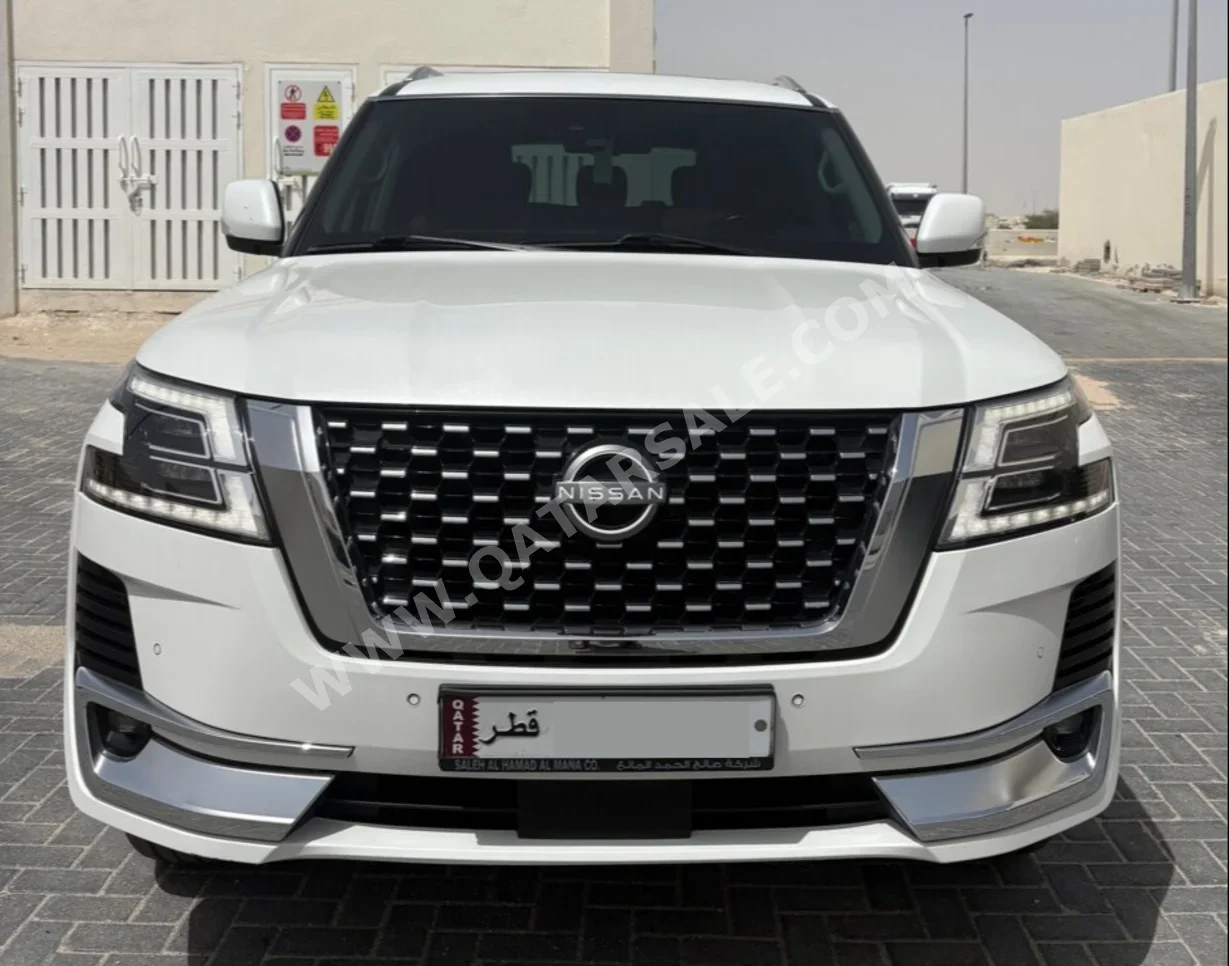 Nissan  Patrol  Platinum  2023  Automatic  136,000 Km  6 Cylinder  Four Wheel Drive (4WD)  SUV  White  With Warranty