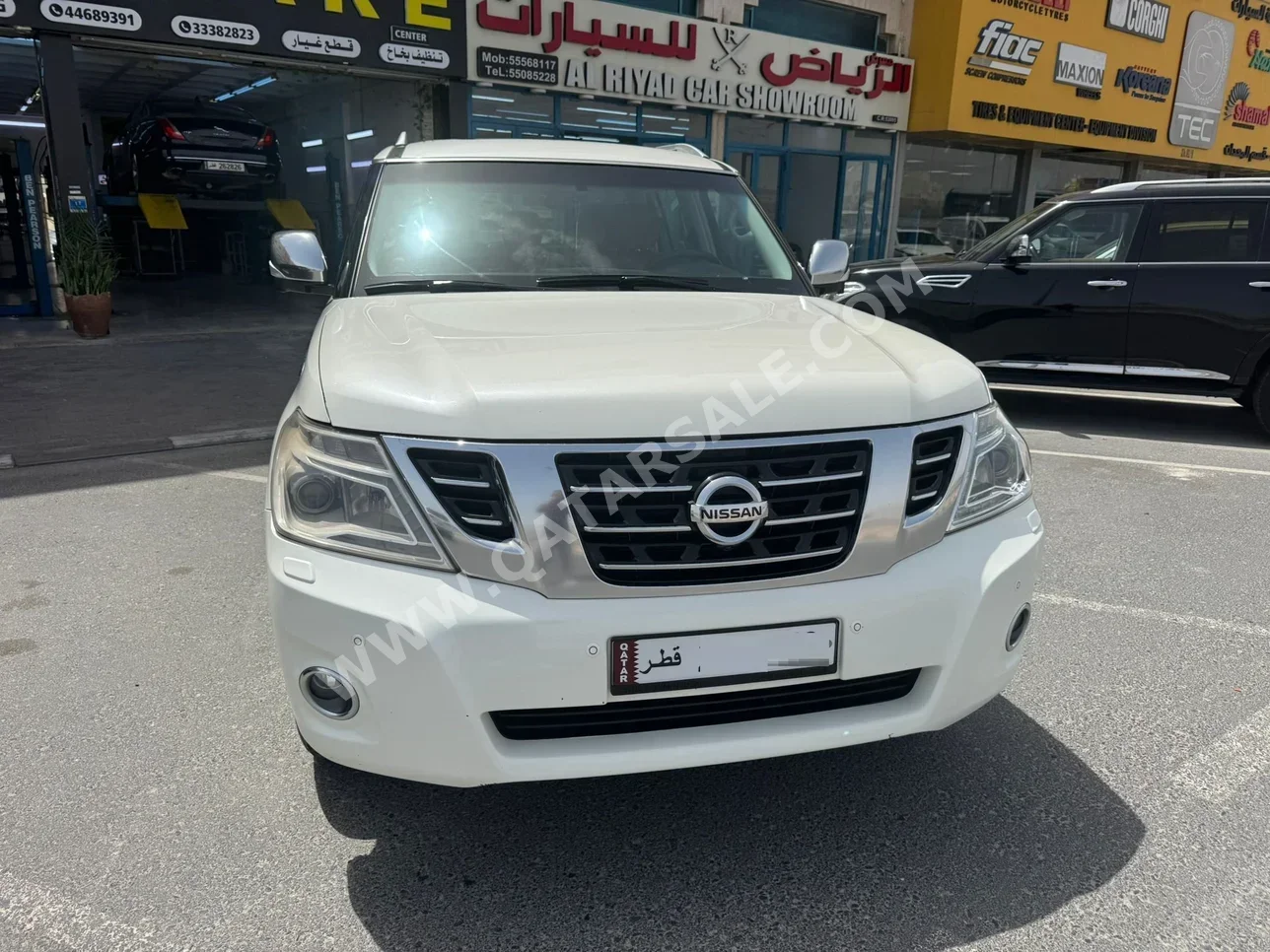 Nissan  Patrol  Platinum  2014  Automatic  317,000 Km  8 Cylinder  Four Wheel Drive (4WD)  SUV  White