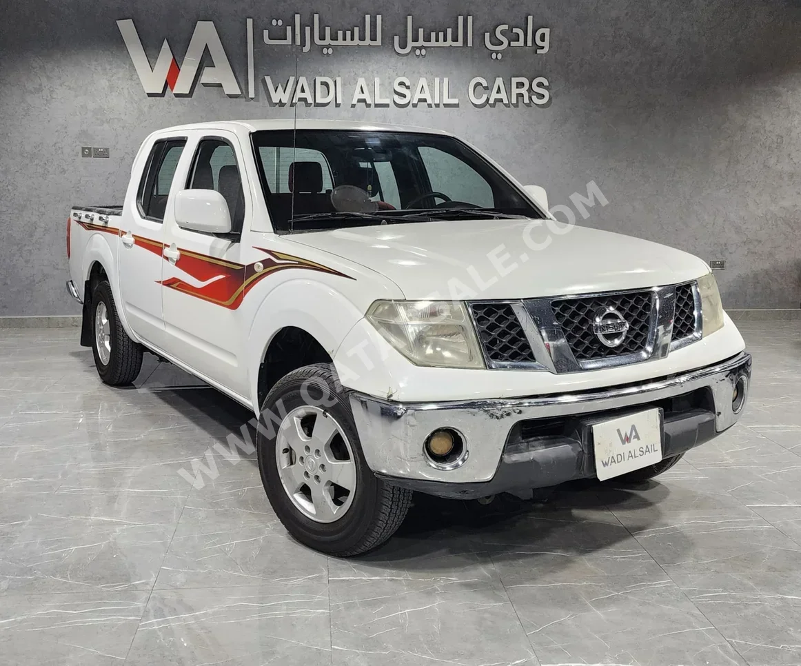 نيسان نافارا أس اي 2015 اوتوماتيك 198,000 كم 4 سلندر دفع خلفي بيكب أبيض