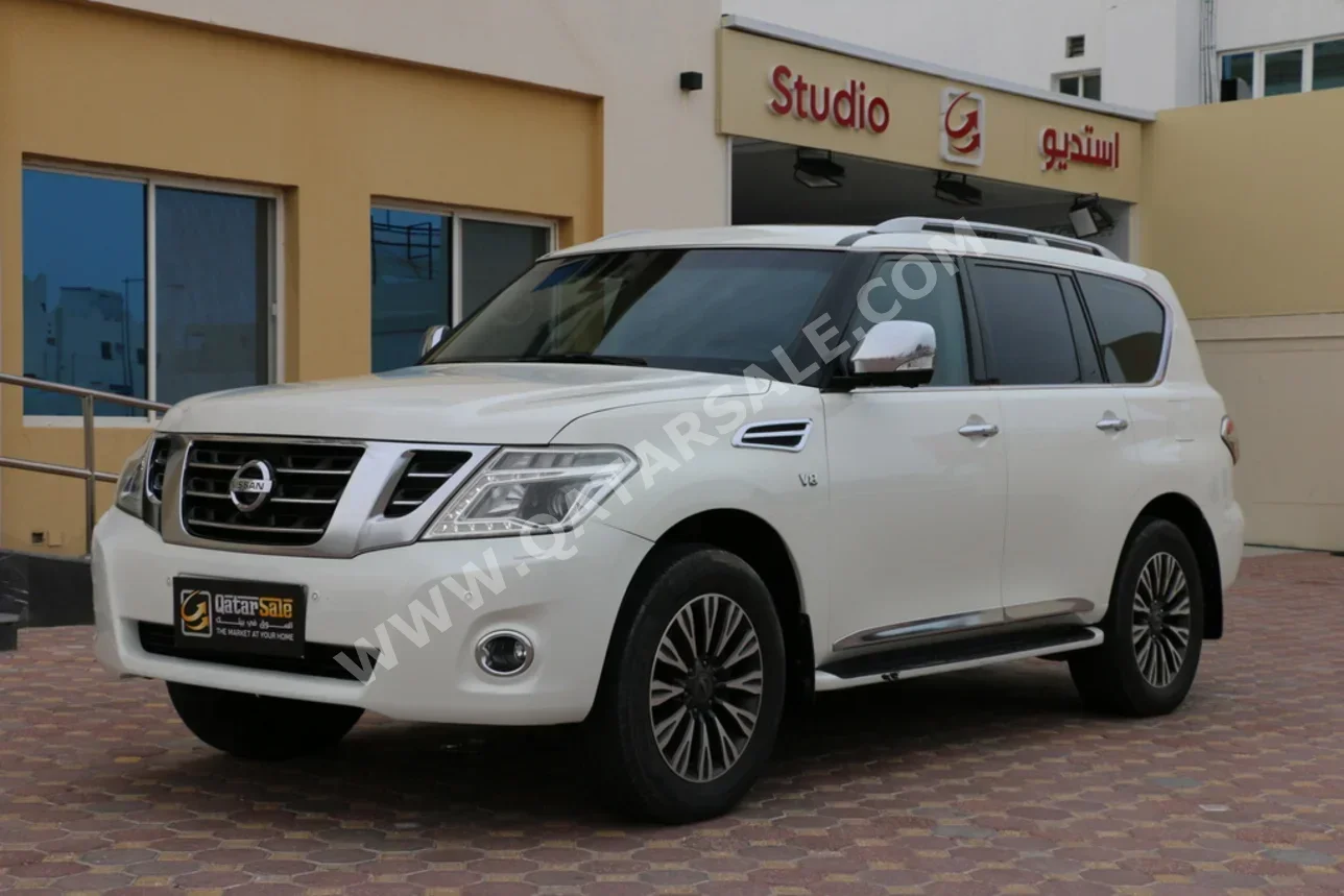 Nissan  Patrol  Platinum  2014  Automatic  353,000 Km  8 Cylinder  Four Wheel Drive (4WD)  SUV  White
