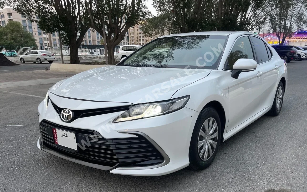 Toyota  Camry  LE  2023  Automatic  71,000 Km  4 Cylinder  Front Wheel Drive (FWD)  Sedan  White  With Warranty