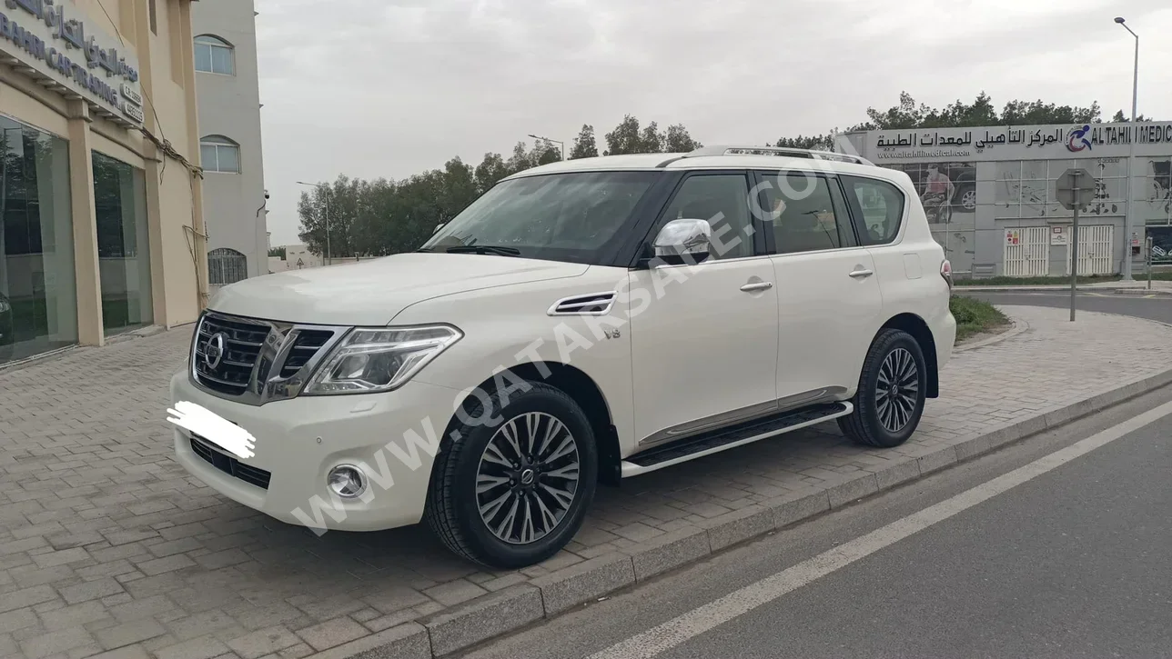 Nissan  Patrol  Platinum  2015  Automatic  143,000 Km  8 Cylinder  Four Wheel Drive (4WD)  SUV  White