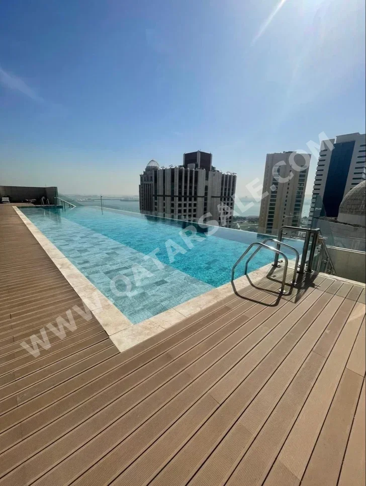 4 Bedrooms  Apartment  For Rent  in Doha -  West Bay  Fully Furnished