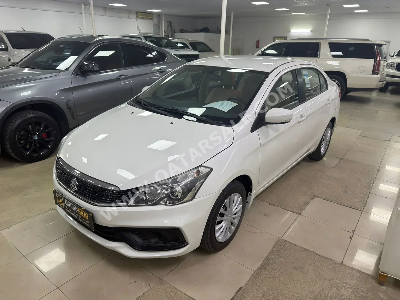 Suzuki  Ciaz  2024  Automatic  13,000 Km  4 Cylinder  Front Wheel Drive (FWD)  Sedan  White  With Warranty