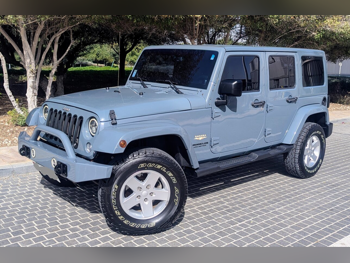 Jeep  Wrangler  Sahara  2014  Automatic  103,000 Km  6 Cylinder  Four Wheel Drive (4WD)  SUV  Blue and Gray