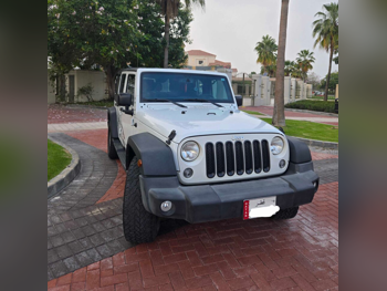 Jeep  Wrangler  Sport  2016  Automatic  110,986 Km  6 Cylinder  Four Wheel Drive (4WD)  SUV  White and Black
