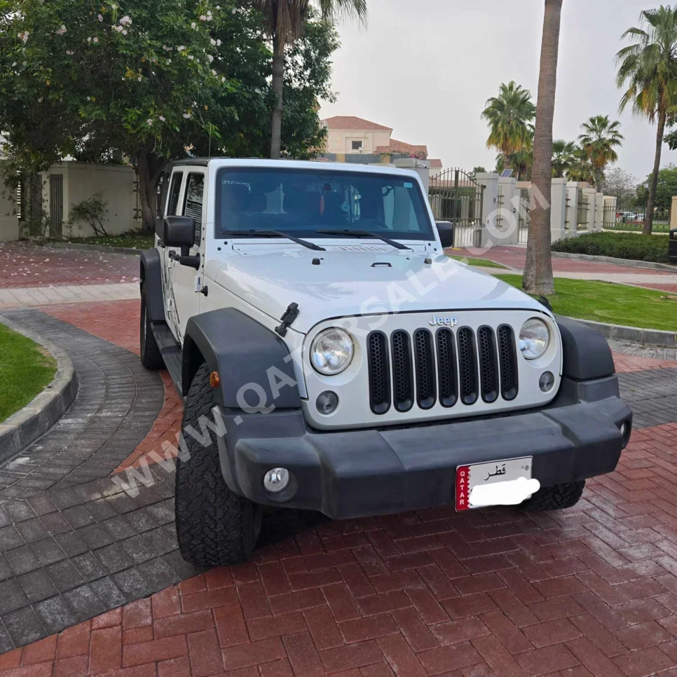 Jeep  Wrangler  Sport  2016  Automatic  110,986 Km  6 Cylinder  Four Wheel Drive (4WD)  SUV  White and Black