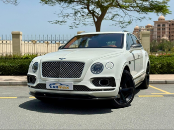 Bentley  Bentayga  2018  Automatic  61,000 Km  12 Cylinder  Four Wheel Drive (4WD)  SUV  White