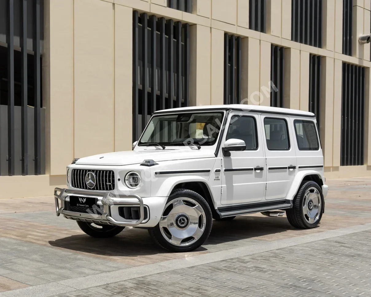 مرسيدس - بنز  جي - كلاس  63 اي ام جي  2025  اوتوماتيك  20,000 كم  8 سلندر  دفع رباعي  اس يو في  أبيض  تحت الضمان