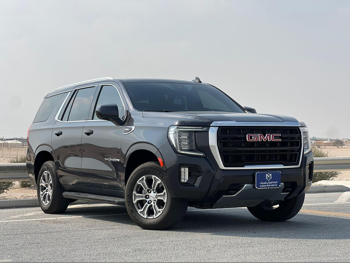 GMC  Yukon  SLE  2023  Automatic  100,000 Km  8 Cylinder  Rear Wheel Drive (RWD)  SUV  Gray