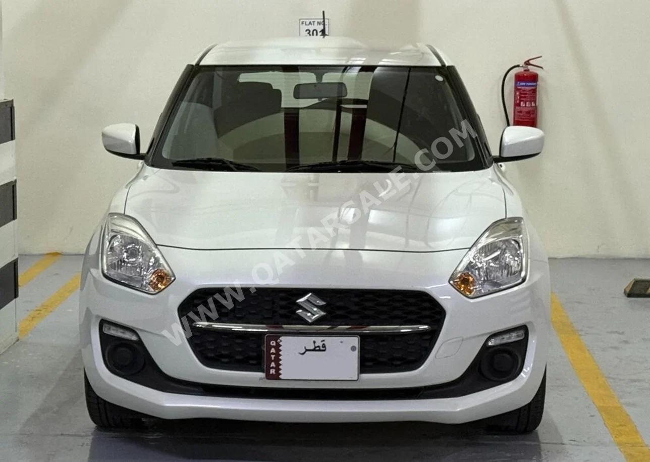 Suzuki  Swift  2023  Automatic  38,000 Km  4 Cylinder  Front Wheel Drive (FWD)  Hatchback  White