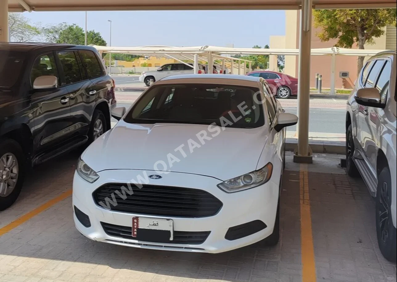Ford  Fusion  2016  Automatic  210,000 Km  4 Cylinder  Front Wheel Drive (FWD)  Sedan  White