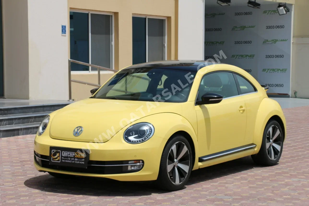 Volkswagen  Beetle  Turbo  2015  Automatic  42,000 Km  4 Cylinder  Front Wheel Drive (FWD)  Hatchback  Yellow