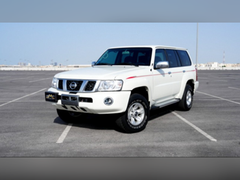 Nissan  Patrol  Safari  2023  Automatic  10,000 Km  6 Cylinder  Four Wheel Drive (4WD)  SUV  White  With Warranty