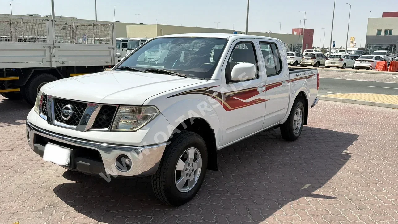 Nissan  Navara  SE  2015  Automatic  234,000 Km  4 Cylinder  Rear Wheel Drive (RWD)  Pick Up  White